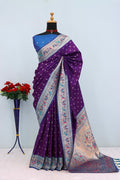 Has floral and peacock motifs on the zari border and pallu - PURPLE